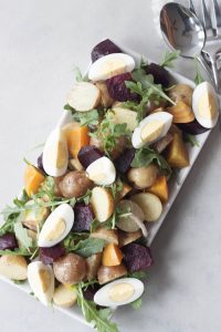 Roasted Beet Potato Salad isn't your grannys potato salad, this colorful salad has spunk, added nutrition, and it's own beet. A Whisk and Two Wands