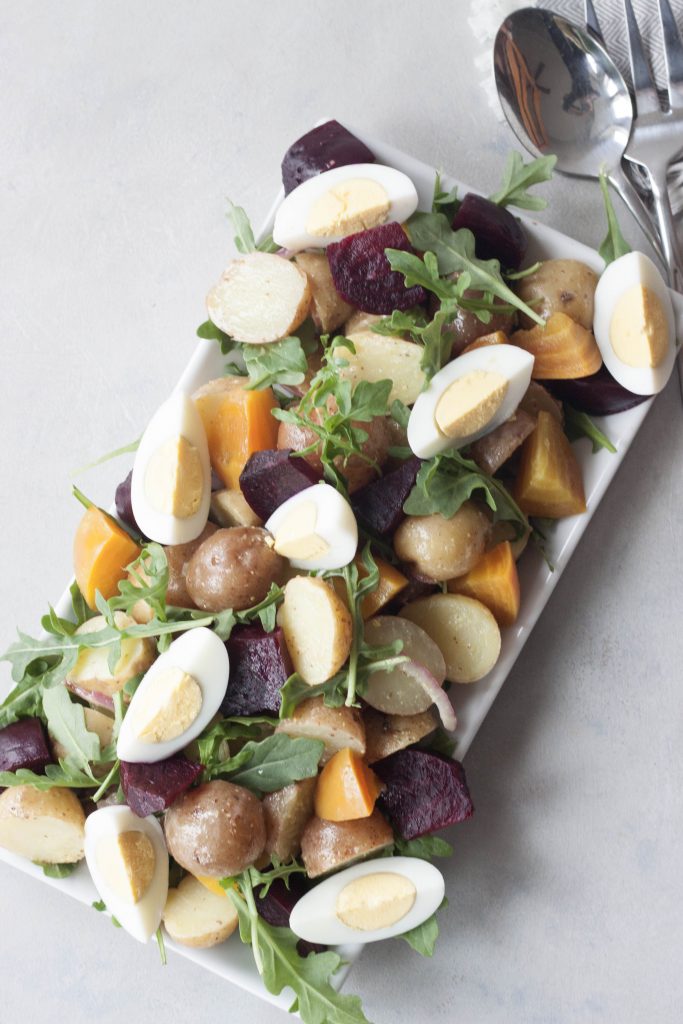 Roasted Beet Potato Salad isn't your granny's potato salad, this colorful salad has spunk, added nutrition, and it's own beet. A Whisk and Two Wands