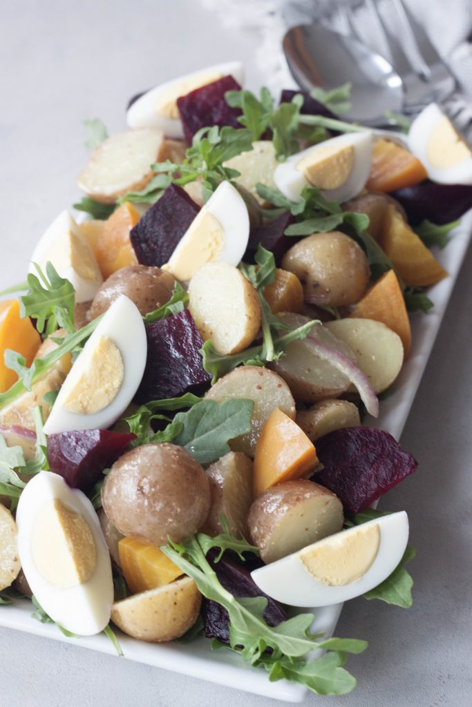 Roasted Beet Potato Salad isn't your granny's potato salad, this colorful salad has spunk, added nutrition, and it's own beet. A Whisk and Two Wands