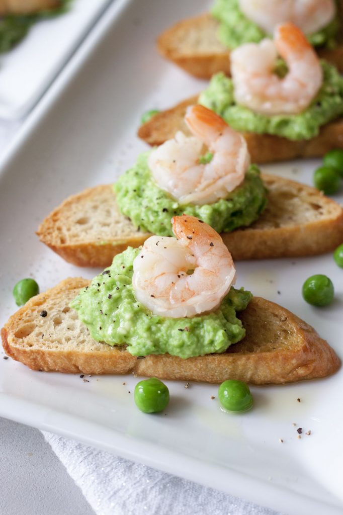 Crostini with Fresh Pea Pesto with shrimp , A Whisk and Two Wands