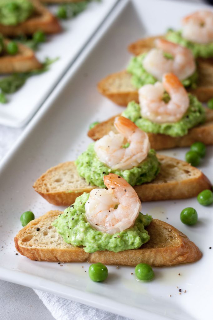 Crostini with Fresh Pea Pesto with shrimp , A Whisk and Two Wands