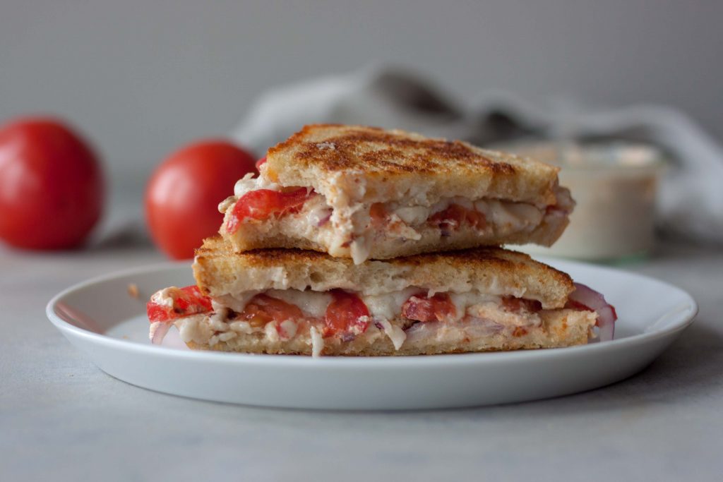 Grilled Cheese Tomato Sandwich on sourdough with bite