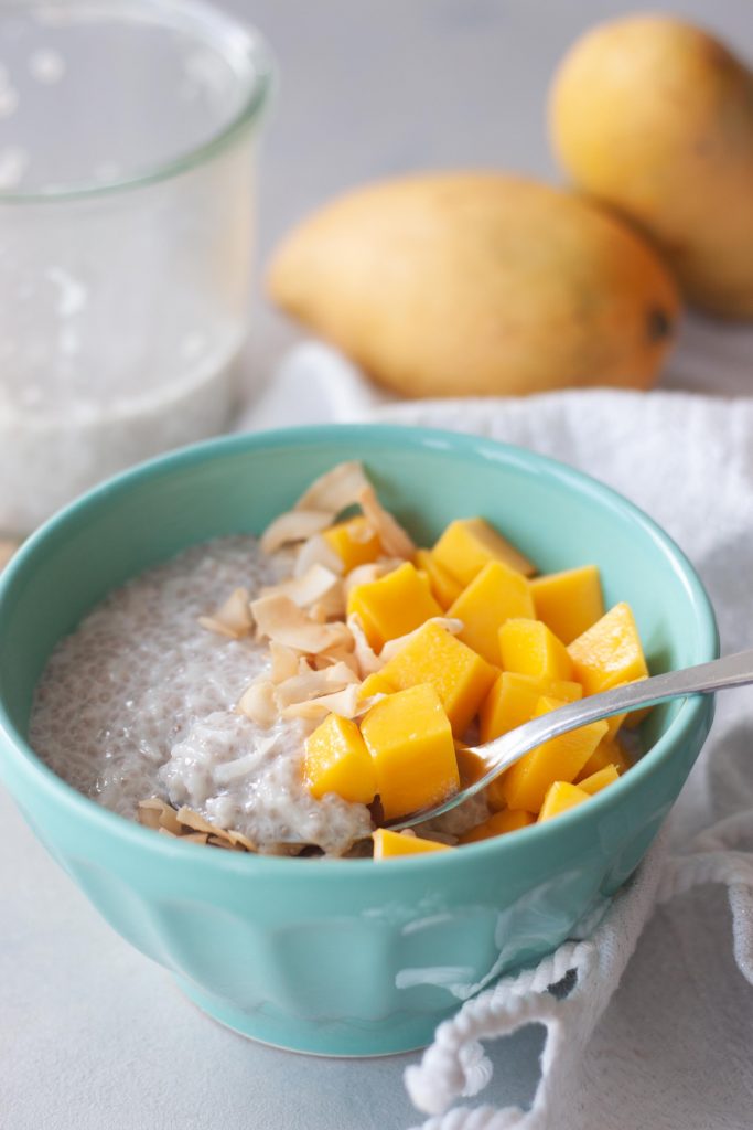 Mango Coconut Chia Rice Pudding with spoon