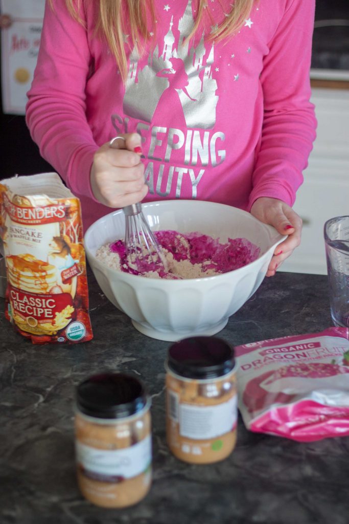 girl in the kitchen making pancakes