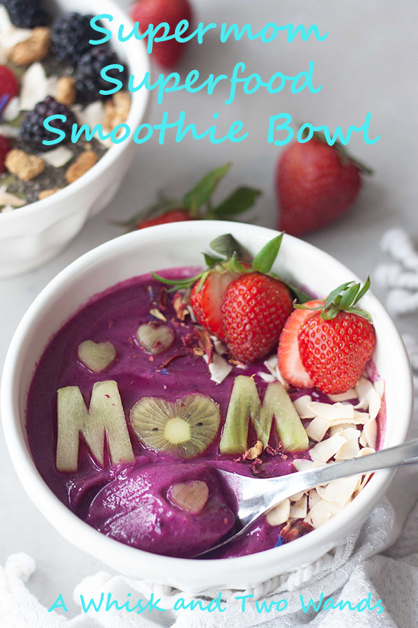 Supermom (with pink power) Superfood Smoothie Bowl is a pretty pitaya superfood packed smoothie bowl to give mom the energy needs to be SuperMom! Customizable plant-based (vegan and gluten free) smoothie with super food boosts!