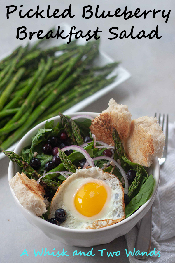 Flavor and nutrition packed with Pickled Blueberry Breakfast Salad is greens, grilled asparagus, pickled blueberries, onion, sunflower seeds topped with optional sourdough toaster croutons and an egg! Perfect for breakfast as well as lunch or dinner!