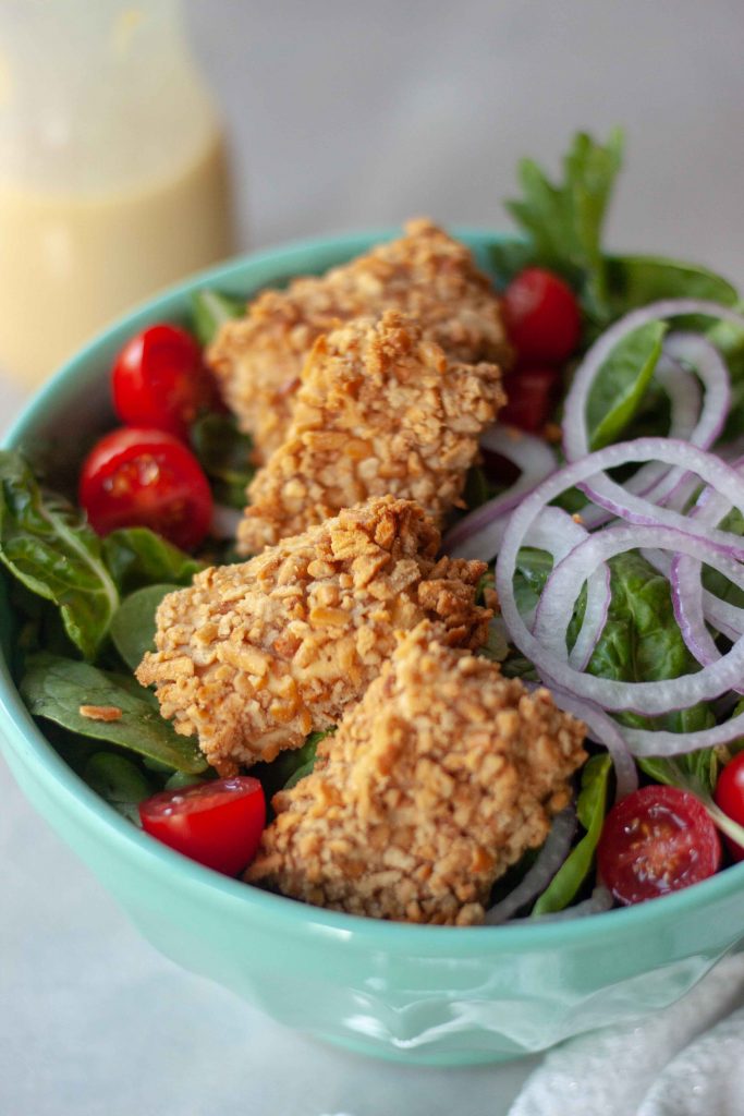 Close up of Pretzel Crusted Tofu on Salad