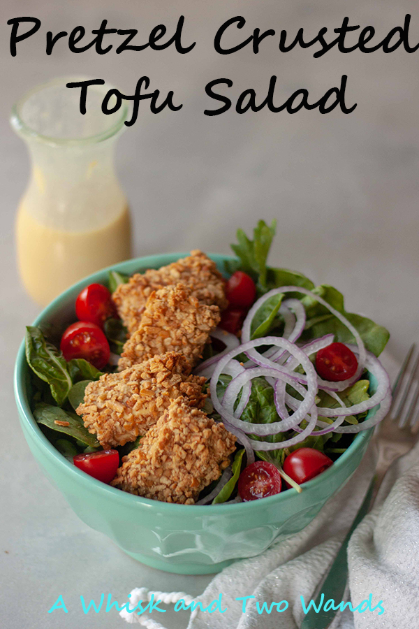 Pretzel Crusted Tofu Salad is a bed of greens topped with tomatoes, onions, crunchy gluten-free pretzel crusted tofu nuggets, and drizzled with homemade honey mustard dressing! Quick and easy it makes a great weeknight dinner.