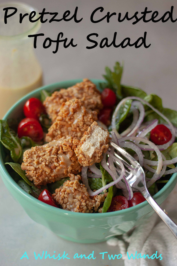 Pretzel Crusted Tofu Salad is a bed of greens topped with tomatoes, onions, crunchy gluten-free pretzel crusted tofu nuggets, and drizzled with homemade honey mustard dressing! Quick and easy it makes a great weeknight dinner.