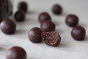 Superfood Brownie Batter Bites and bite to show inside