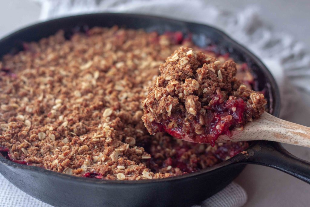 Cast Iron Cranberry Crisp with spoon