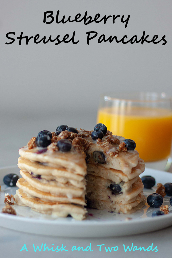 Blueberry Streusel Pancakes Fluffy stack of gluten free vegan friendly pancakes bursting with blueberries with a hint of everything you love from a blueberry streusel muffin including the crumble topping and icing. A stack is sure to sweeten up any morning!