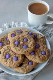 Plate of Milk Monster Cookies and cup of coffee.