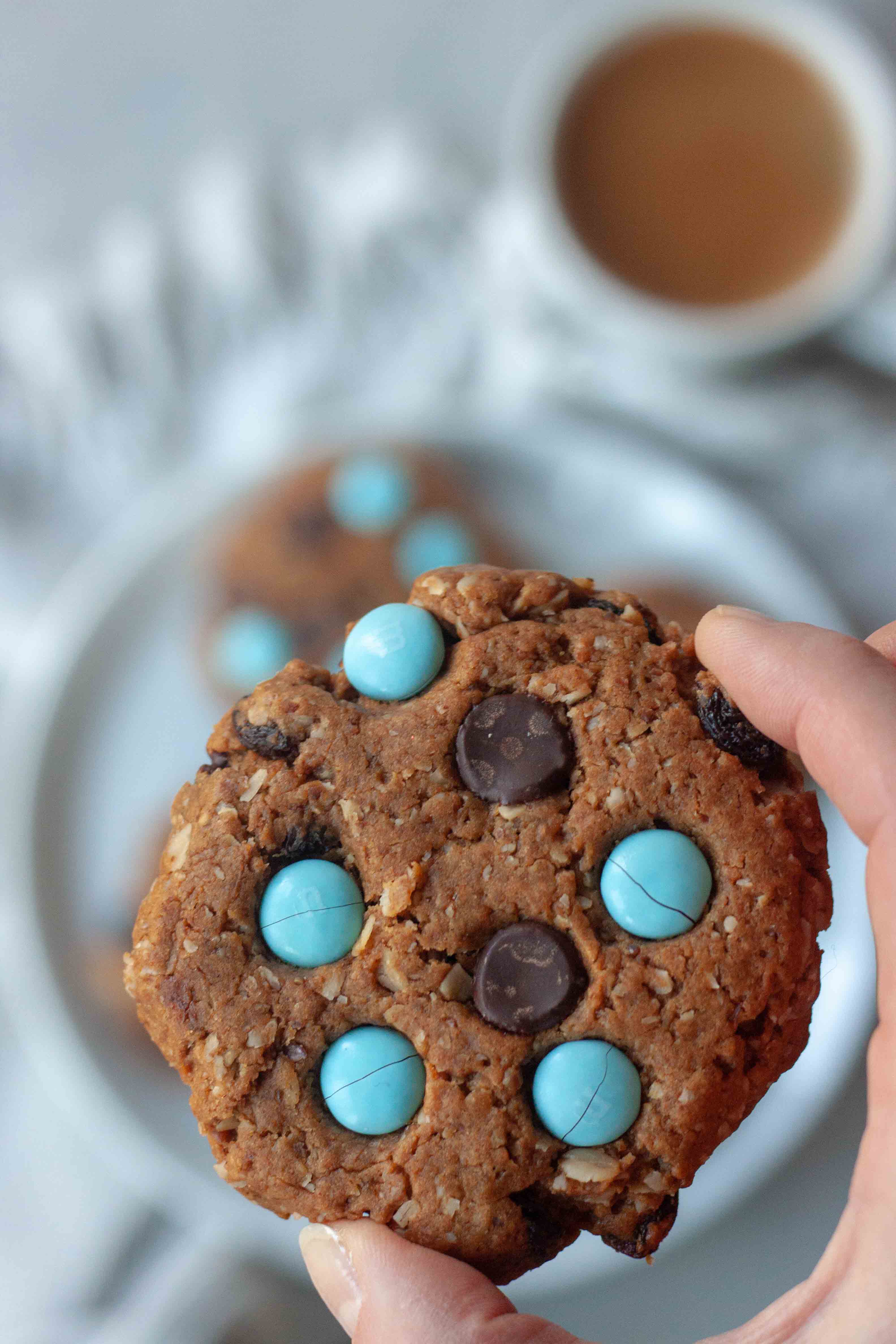 Holding a Milk Monster Cookie.