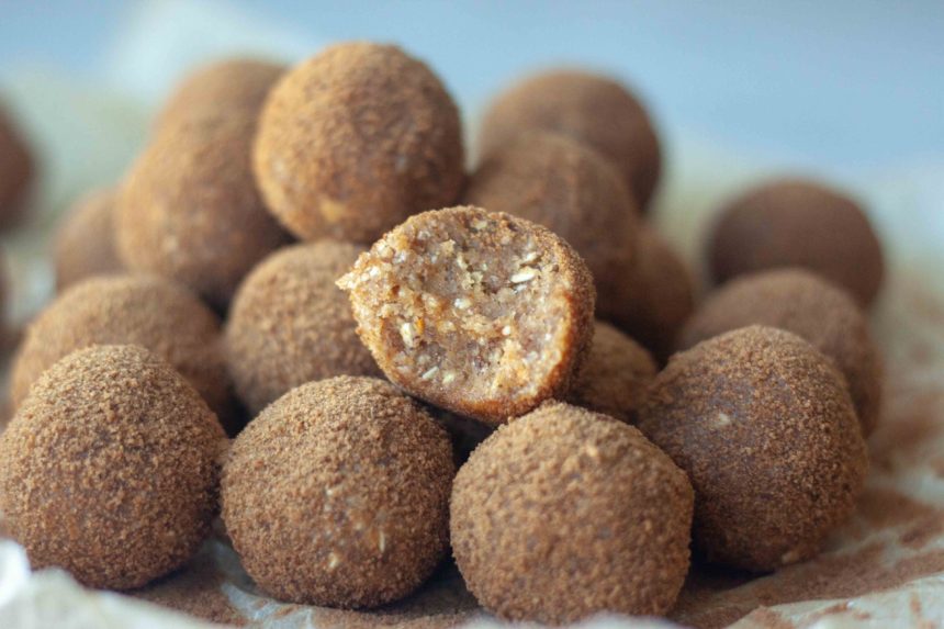 Bite and Pile of Cinnamon Sweet Potato No Bake Donut Holes and cinnamon sugar