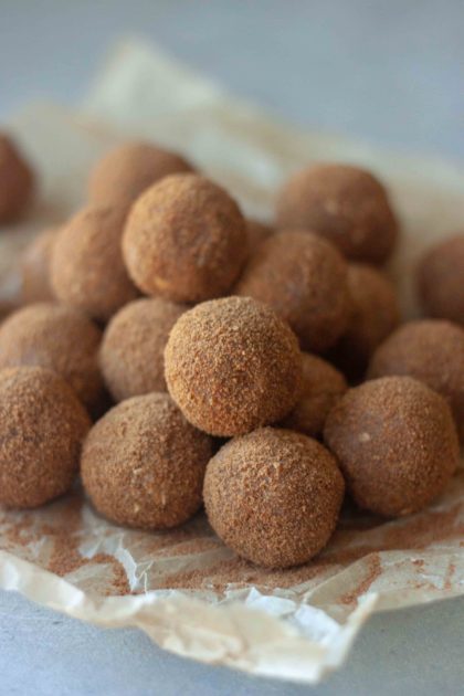 Pile of Cinnamon Sweet Potato No Bake Donut Holes and cinnamon sugar