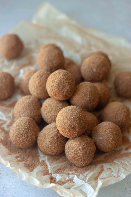 Pile of Cinnamon Sweet Potato No Bake Donut Holes and cinnamon sugar