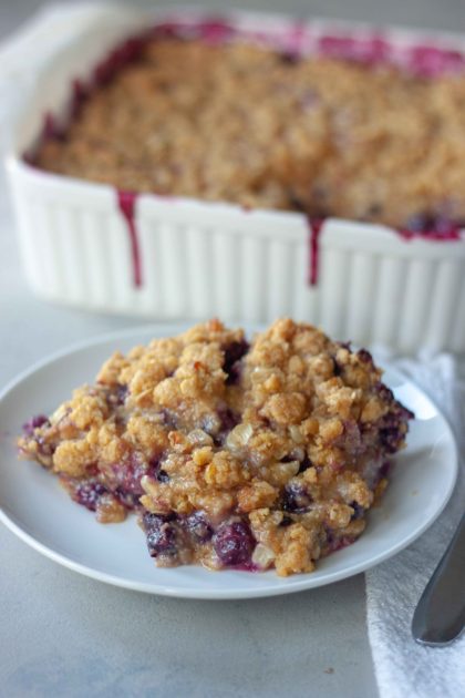 Piece of Sweet Corn Blueberry Crisp with pan behind