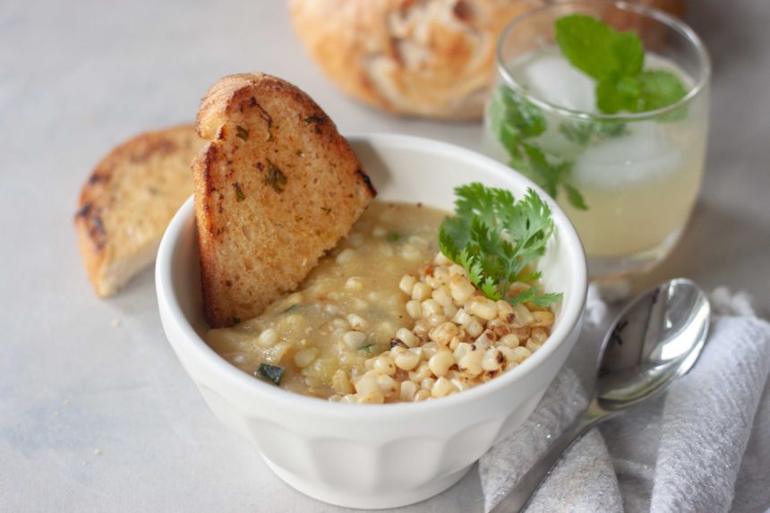 Bowl of Spicy Sweet Corn Soup with Sautéed Chili Lime Corn with toasted bread