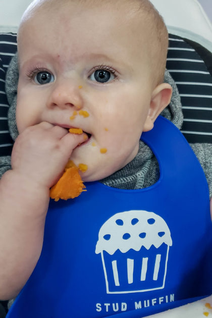 baby eating sweet potatoes