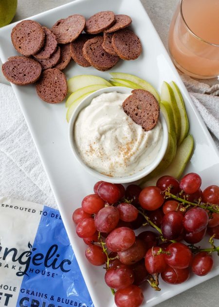 Platter with Angelic Bakehouse Sprouted Crisps, yogurt dip, pears, and grapes