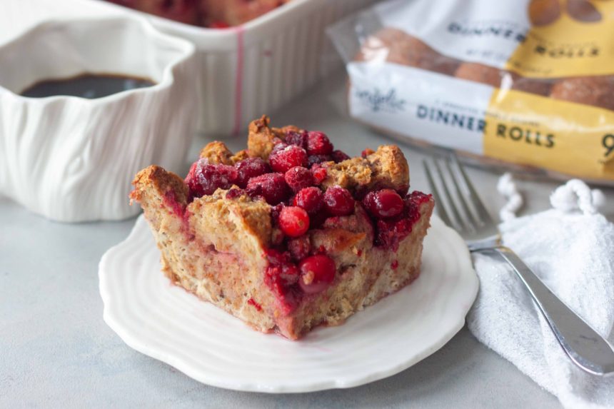 Cran-Berry French Toast Bake on plate with coffee in mug and package of Angelic Bakehouse Sprouted Rolls