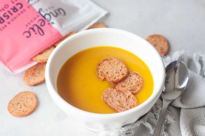 Golden Turmeric Butternut Squash Soup topped with Angelic Bakehouse Sprouted Pickled Sweet Onion & Beet Crisps