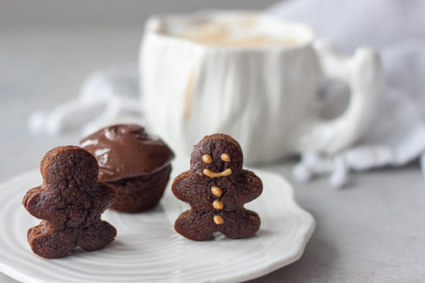 Mini Gingerbread Man Muffins with coffee mug in background