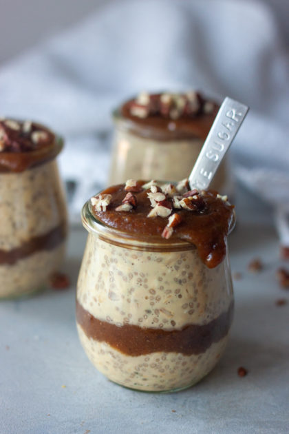 Sticky Toffee Pudding Overnight Oats in jars with spoon