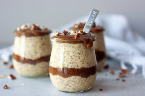 Sticky Toffee Pudding Overnight Oats in jars with spoon