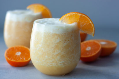 Orange Creamsicle Smoothies in glasses with oranges