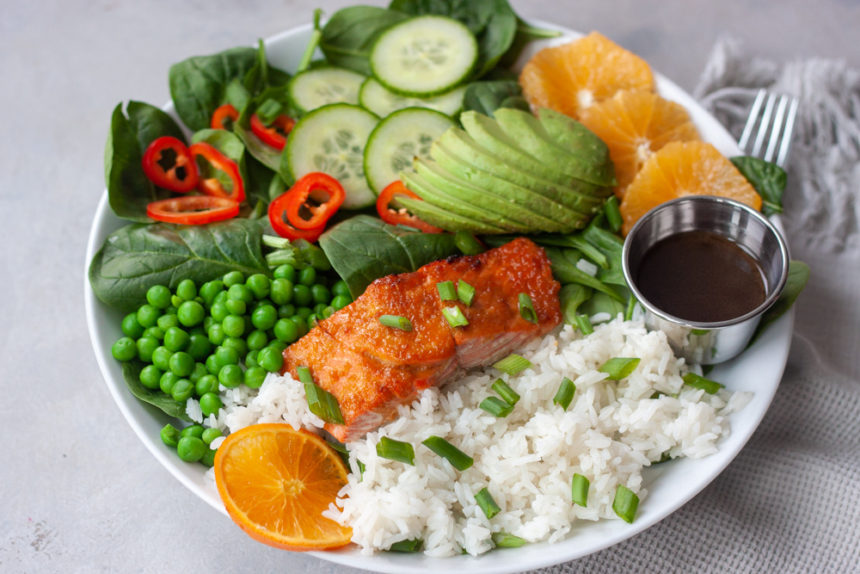 Orange Salmon Asian Veggie Bowls are one of the ways to customize my Asian Veggie Bowls adding salmon! Simple, anything but boring, delicious grain bowls that are packed with whole food flavor and easily customizable for the whole family. Easy to make, can be prepped ahead for a quick weeknight dinner.