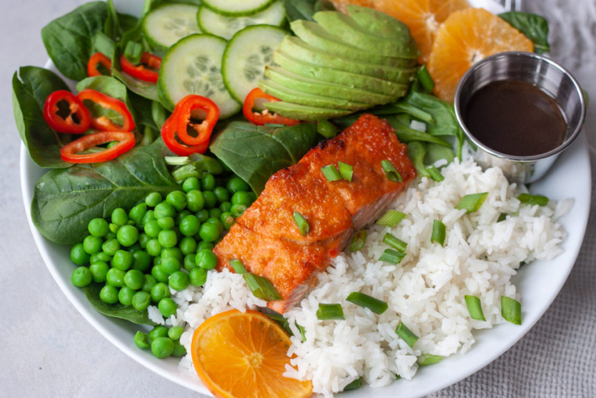 Orange Salmon Asian Veggie Bowls are one of the ways to customize my Asian Veggie Bowls adding salmon! Simple, anything but boring, delicious grain bowls that are packed with whole food flavor and easily customizable for the whole family. Easy to make, can be prepped ahead for a quick weeknight dinner.