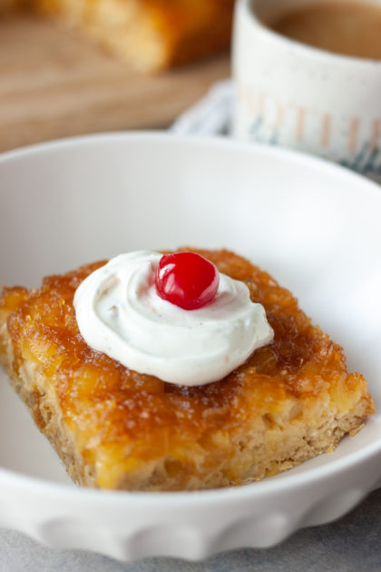 Pineapple Upside-Down Oatmeal Cake in bowl with coffee