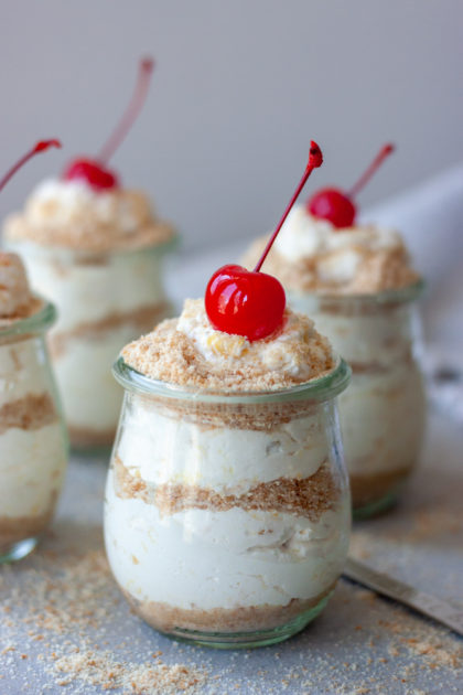 Life's A Beach Parfaits topped with cherries with spoon