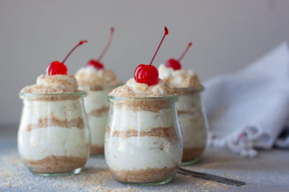 Life's A Beach Parfaits topped with cherries with spoon