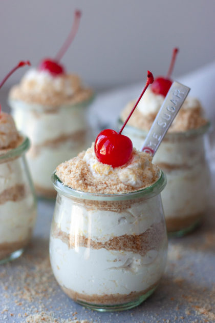 Life's A Beach Parfaits topped with cherries with spoon