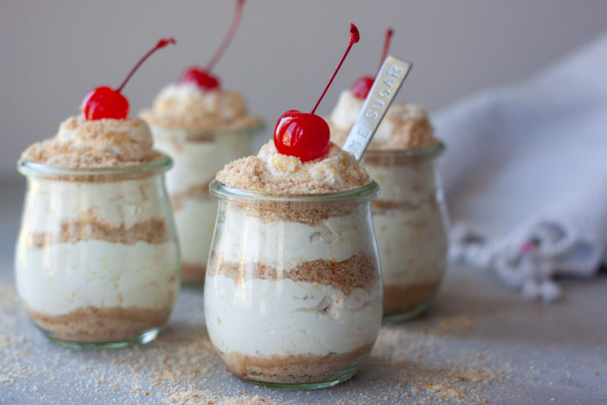 Life's A Beach Parfaits topped with cherries with spoon