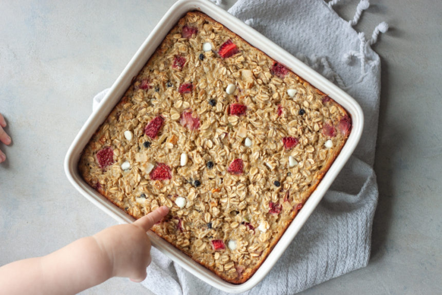 Red White Blueberry Muesli Baked Oatmeal with toddler hand