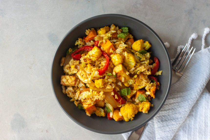 Flavor and nutrition packed gluten free and vegan Curry Cauliflower Grain Bowl 2.0 is meal prep friendly and great for lunch or dinner. Brown rice, roasted curry cauliflower, sauteed red pepper and onions, roasted sweet potatoes, optional crispy citrus tofu, fresh mint, and a Ginger Curry Dressing!