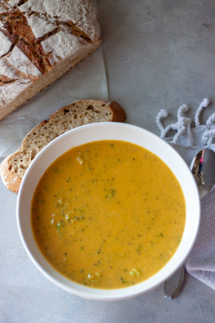 Bowl of Cheesy Broccoli No Cheese Soup with bread