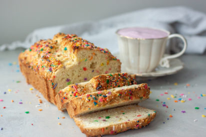 Sliced Sprinkle Scone Loaf and pink latte