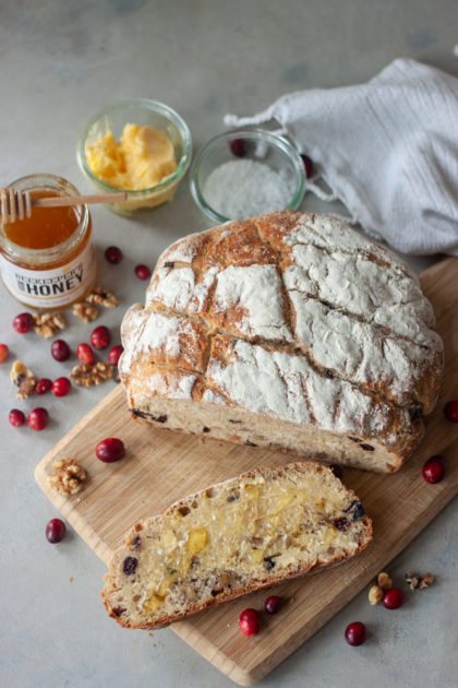 Cranberry Walnut Spelt Sourdough Bread slice with honey