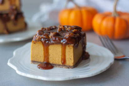 Pecan Pumpkin Pie Vegan Cheesecake Bars are a Thanksgiving must! Delicious creamy pumpkin cheesecake topped with caramel and pecans for a decadent gluten free, paleo, and vegan friendly.