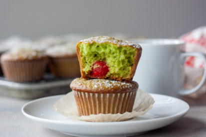 Two Grinch muffins stacked showing inside.