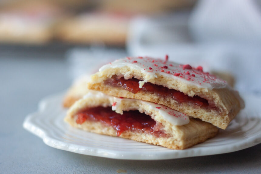 Homemade Strawberry Pop Tarts are a simple , fresh, and healthier twist on classic pop tarts that you can customize. Made easy with pancake mix these pop tarts are vegan and there are links to paleo, and gluten free options.